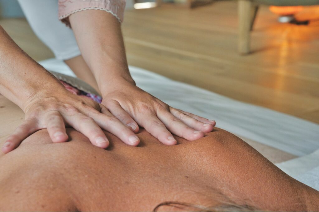 lady hands on back massaging